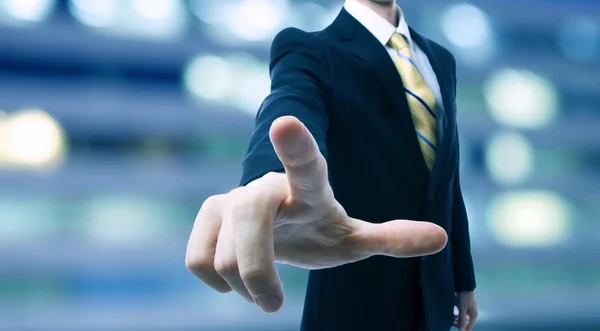 Businessman touching a touch screen