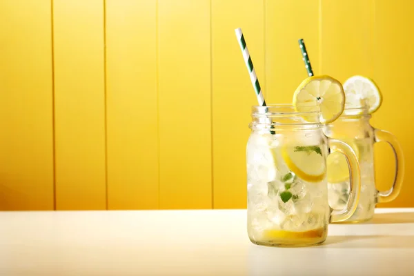 Lemonade in mason jars with straw