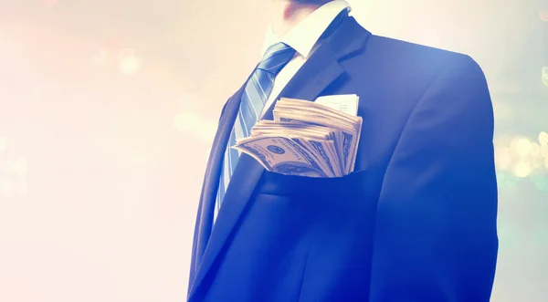 Businessman with wad of cash