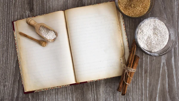 Vintage recipe book with sweet ingredient for pastry-making