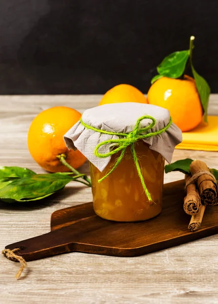 Orange marmalade jar flavored with cinnamon