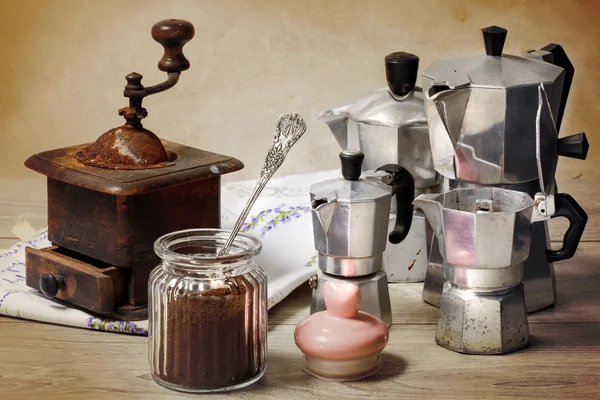 Coffee powder with vintage coffee grinder and coffee maker