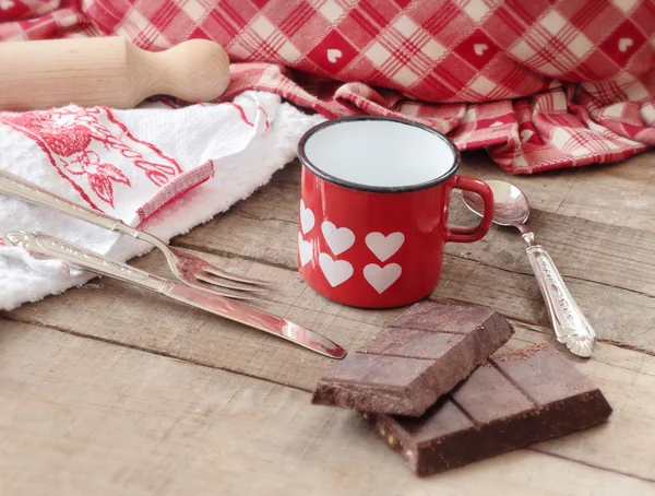 Modica chocolate bar inside hearts decorated mug with kitchen ut