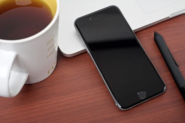 Coffee work table with mobile devices top view