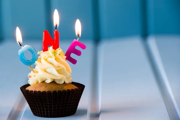 Cupcake with a candles for 1 - first birthday