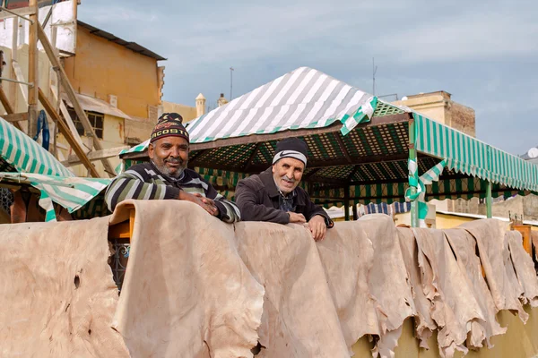 Laborers working in Chouwara tannery. Fez El Bali Medina. Morocco.