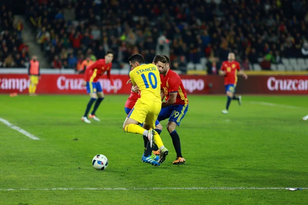 Romanian football player Nicolae Stanciu in action against Spain