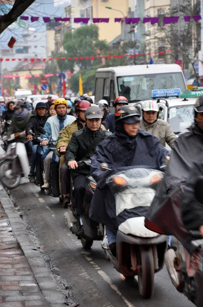 Traffic in Hanoi. Crowd of motorbike drivers on the street