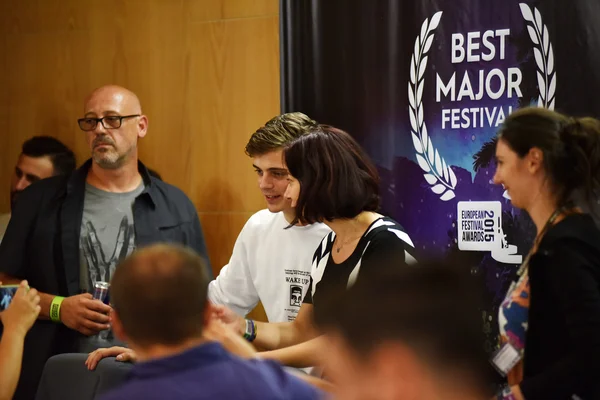 Dj Martin Garrix signs autographs for fans at a press conference