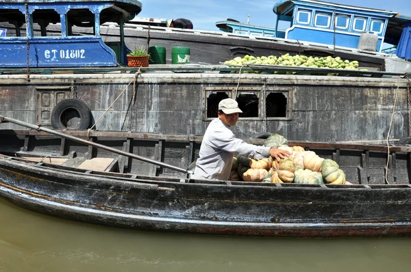 Fruit seller in the Cai Rang Floating market, Mekong delta, Viet