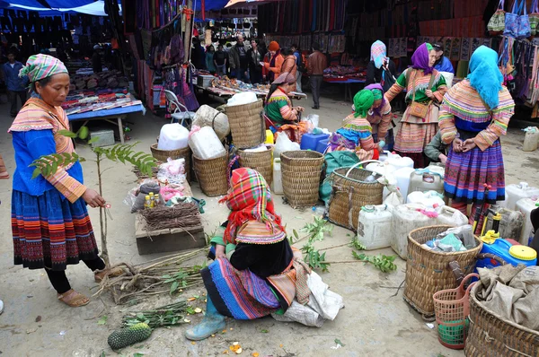 Vietnamese people wearing traditional costume in Bac Ha market,