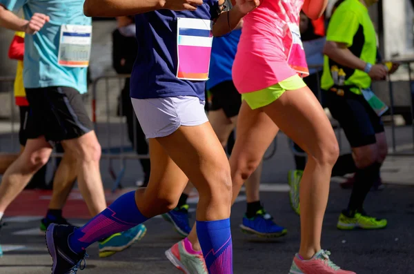 Marathon running race, people feet on road, women run