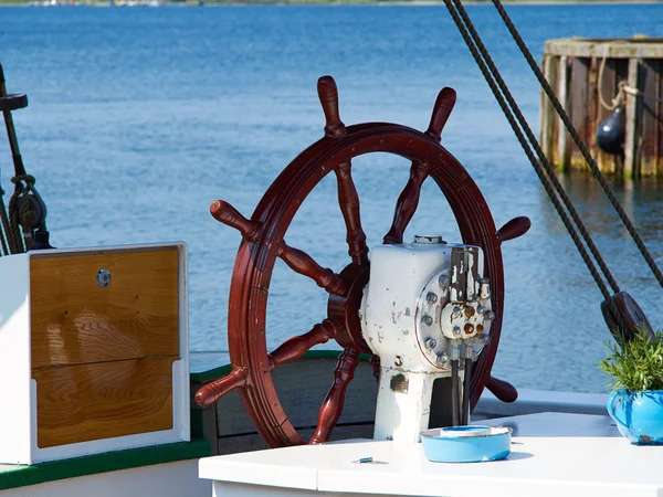 Ship steering wheel on a  sailing boat