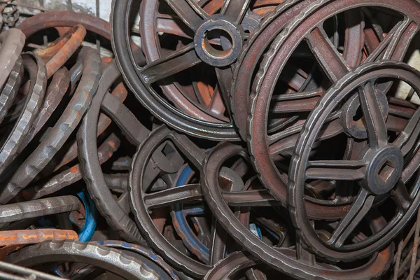 Steel rusted hand wheels in warehouse