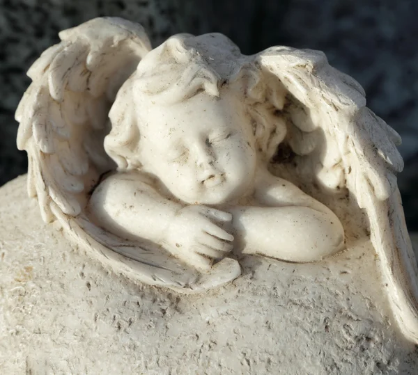 Sleeping little angel figurine