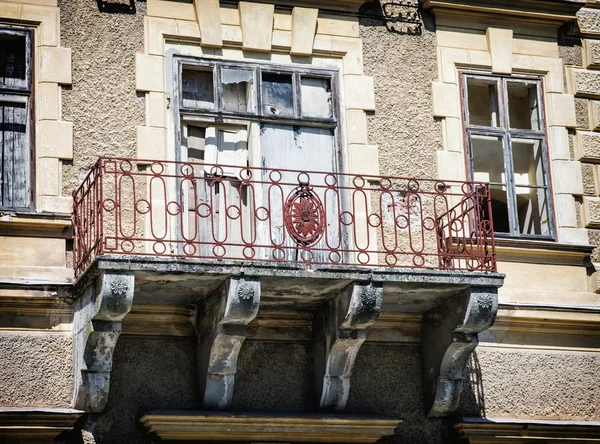 Close up photo of beautiful old house with artistic balcony