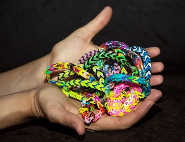 Colorful Rainbow loom bracelet rubber bands fashion on old wood
