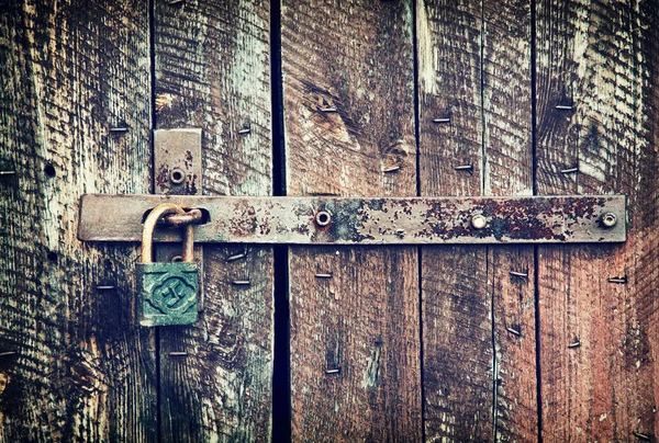 Locked wooden doors close up