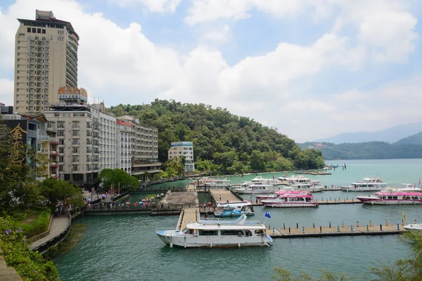 SUN MOON LAKE - JULY 15: many boats parking at the pier on July 15, 2014 at Sun Moon Lake, Taiwan. Sun Moon Lake is the largest body of water in Taiwan as well as a tourist attraction.