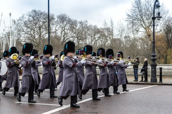 LONDON - APR 15: The changing of the guard ceremony at Buckingham Palace on April 15th, 2013 in London, UK. It is one of England\'s most popular visitor attractions.