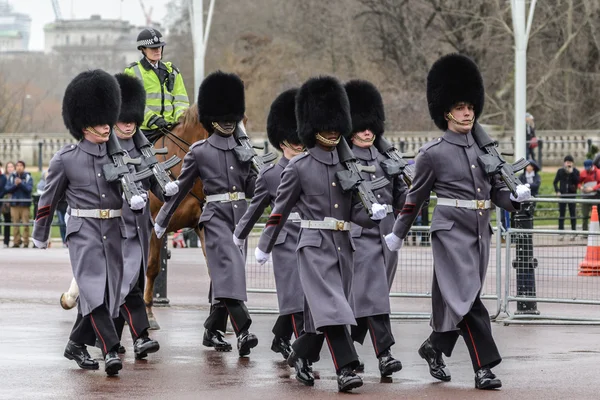 LONDON - APR 15: The changing of the guard ceremony at Buckingham Palace on April 15th, 2013 in London, UK. It is one of England\'s most popular visitor attractions.