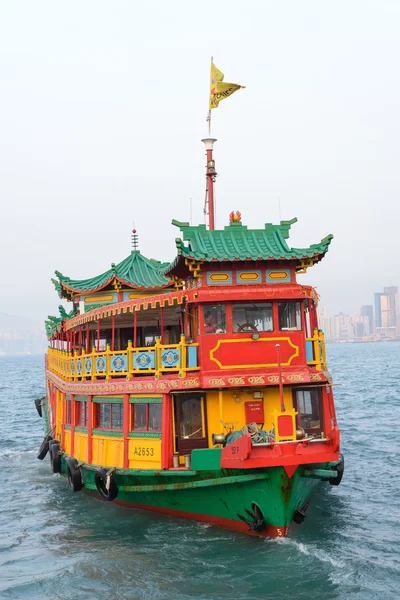 HONG KONG - FEBRUARY 13: Hong Kong\'s iconic traditional red-sailed Chinese junk. The junk boat is the logo of the Hong Kong Tourism Board on Febuary 13, 2014 in Hong Kong.