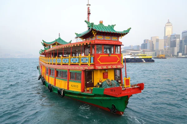 HONG KONG - FEBRUARY 13: Hong Kong\'s iconic traditional red-sailed Chinese junk. The junk boat is the logo of the Hong Kong Tourism Board on Febuary 13, 2014 in Hong Kong.