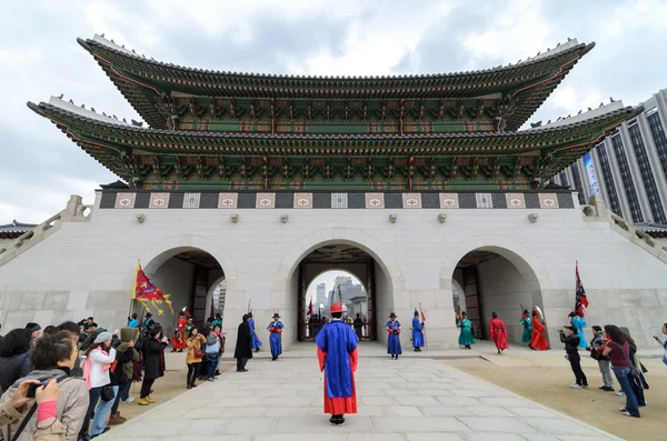 SEOUL - FEBRUARY 14: Guards at Gwanghwamun Gate, the entrance of Gyeongbokgung Palace April 14, 2012 in Seoul, ROK. Guards have been placed at the palace, once home of the king, since the 14th C.