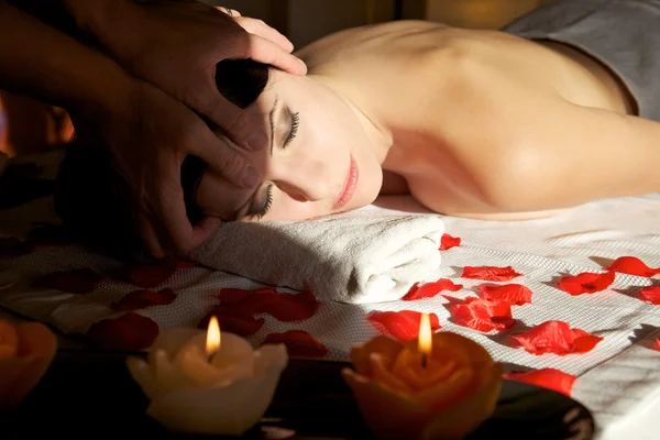 Beautiful woman receiving head massage, closeup photo