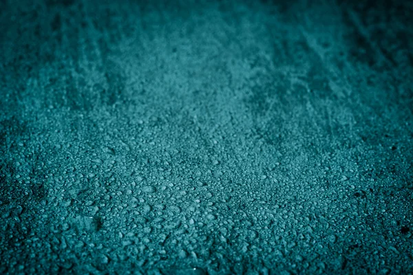 Wet blue concrete background