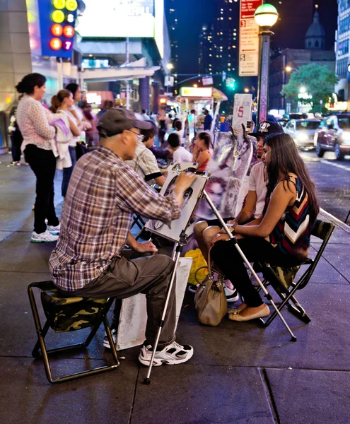 Street artist drawing