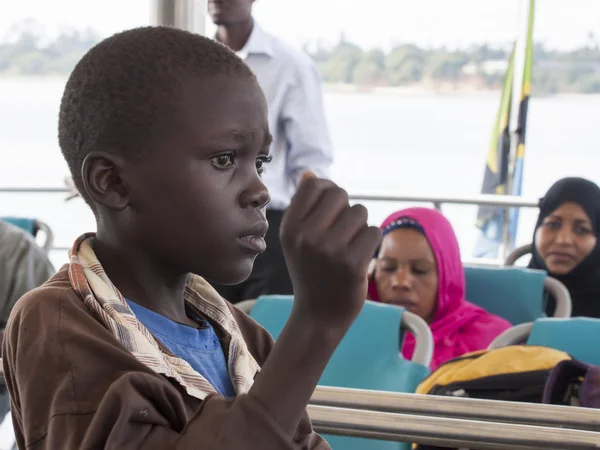 Boy on the ferry that connects to Zanzibar island