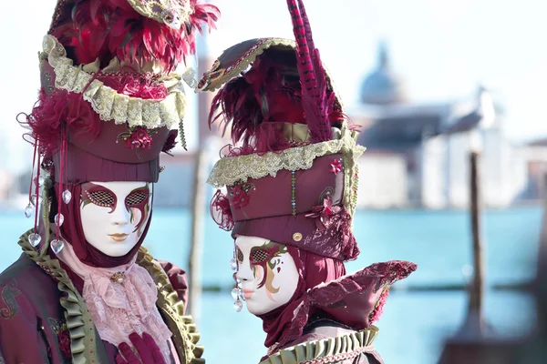 Couple of red masks at the Carnival of Venice