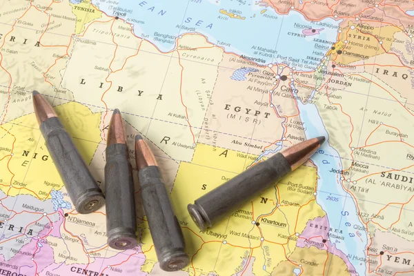 Bullets on the map of Libya and Egypt