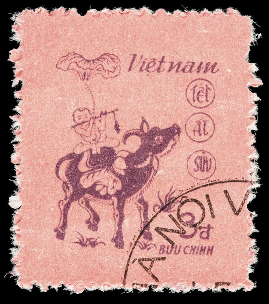 Vietnam postage stamp showing a children on a buffalo for the zodiac lunar year of the buffalo