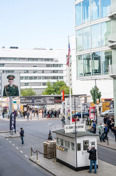 BERLIN, GERMANY - SEPTEMBER 17:   Checkpoint Charlie on September 17, 2013 in Berlin, Germany. It\'s the best-known Berlin Wall crossing point between East and West Berlin during the Cold War.