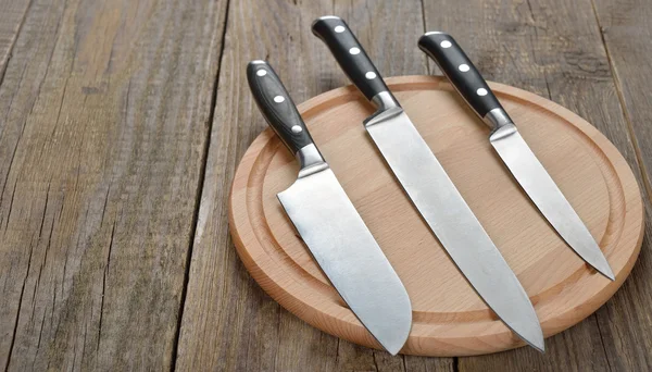 Set of kitchen knives and cutting board