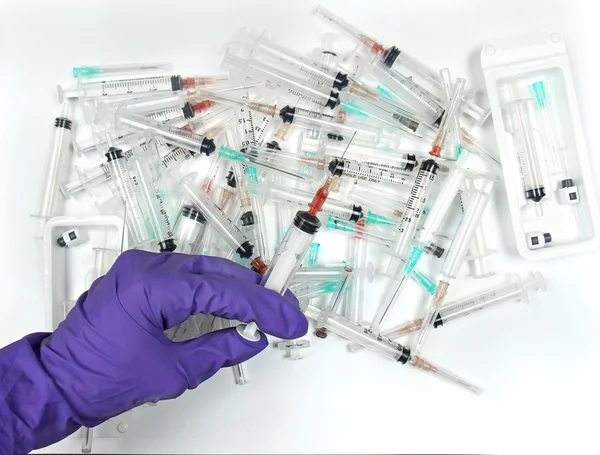 Hand syringes pile