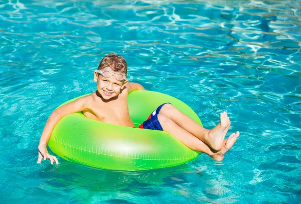 Young Kid Having Fun in the Swimming Pool