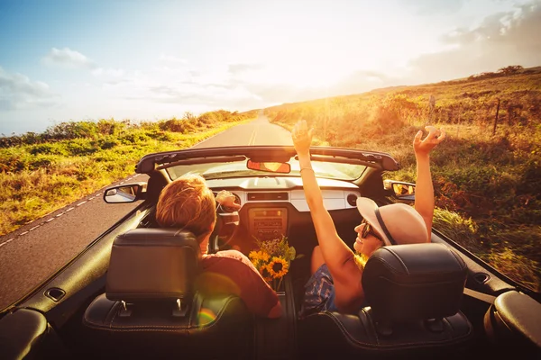 Happy Couple Driving in Convertible