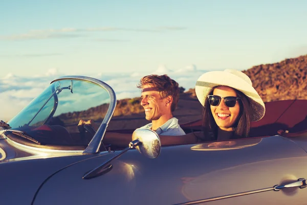 Young Couple in Classic Vintage Sports Car