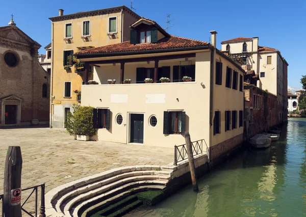 Beautiful view of Venice Canal and ancient pier. sunny day landscape with historical houses, traditional church and square. Italy romantic destination scenic. famous European Union place