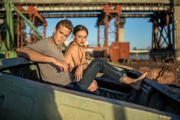 Sexy couple in old boat