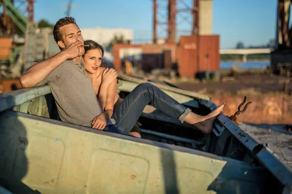 Sexy couple in old boat