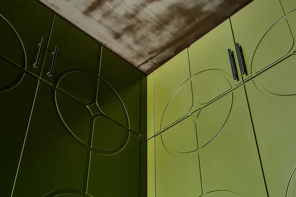 Green wardrobes and ceiling