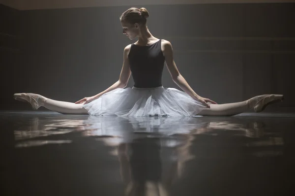 Seated ballerina in the class room