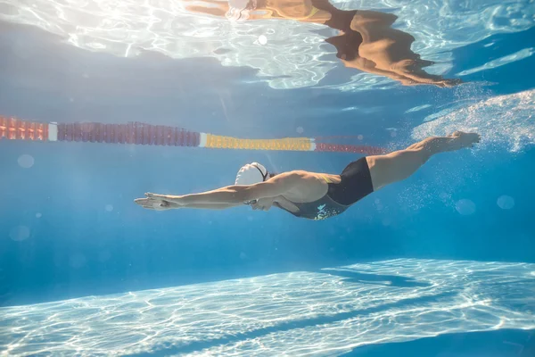Swimmer in crawl style underwater