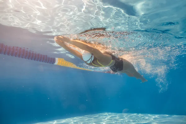 Swimmer in back crawl style underwater