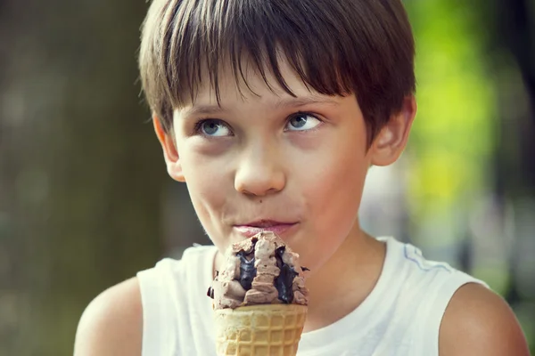 Little boy eating an ice cream