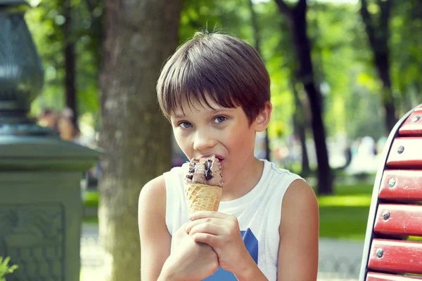 Little boy eating an ice cream
